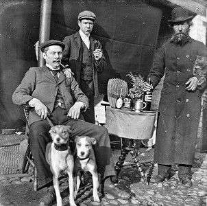 1890's men with dogs and bottles of drink